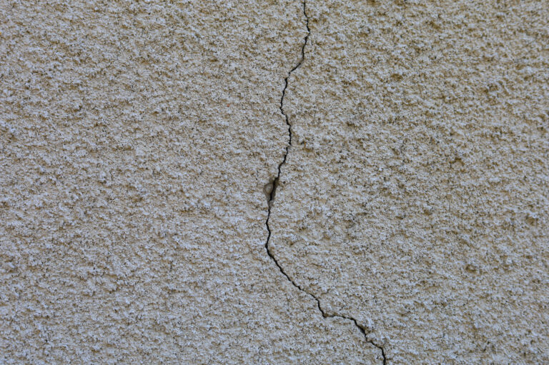 Crack in exterior stucco wall surface